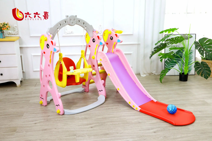 Children's playset with slide and swing in a room with plants and furniture.