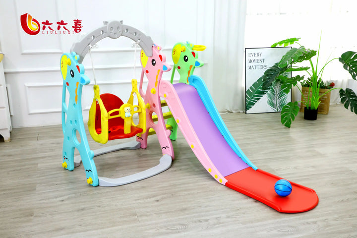 Children's playset with slide and swing in a room with plants and decor.